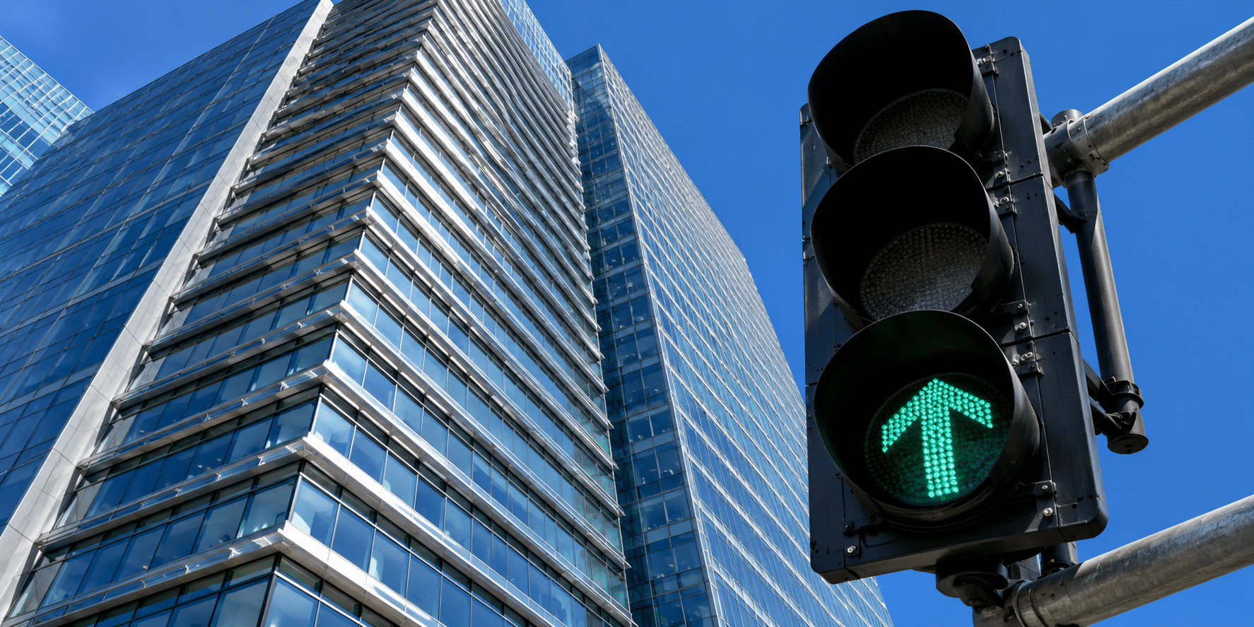 Emerald arrow over the glass tower